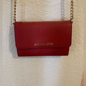 Red Michael Kors crossbody bag